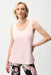 Woman wearing Joseph Ribkoff silky knit scoop neck camisole for office layering outfit
