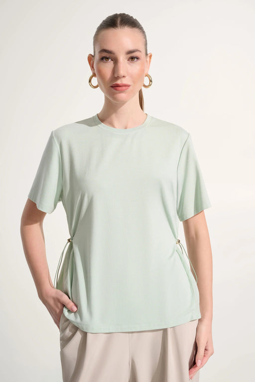 Woman wearing Joseph Ribkoff adjustable sides boxy top styled for casual chic outfits, travel wear, office casual looks, and modern everyday fashion.
