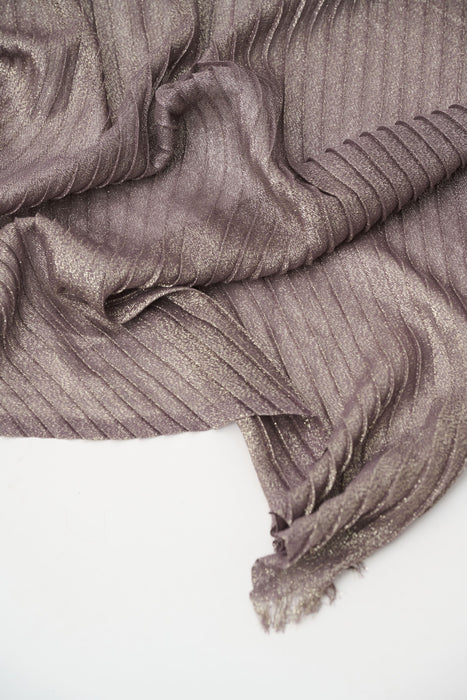 Close-up of a textured brown fabric on a white background