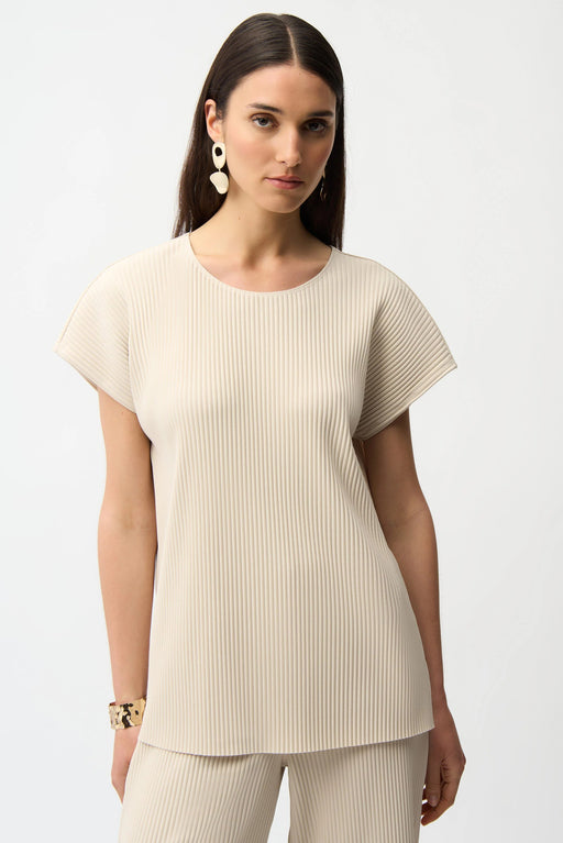 Woman wearing Joseph Ribkoff pleated scuba crepe boxy top styled for office chic, casual outings, travel days, and modern minimalist fashion looks.