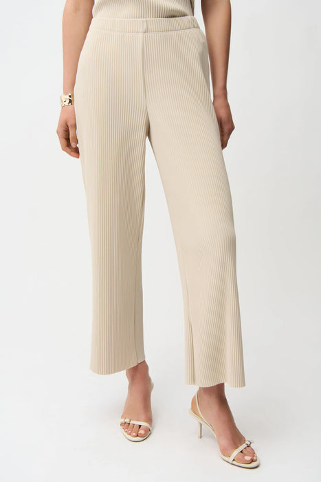Woman wearing Joseph Ribkoff pleated wide leg pull-on pants with ribbed texture