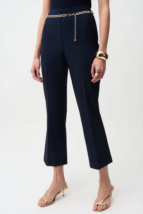 Woman modeling elegant flare pants with slim fit and wide hem
