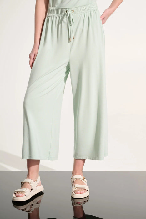Woman wearing Joseph Ribkoff culotte pants with tie waist for casual day out