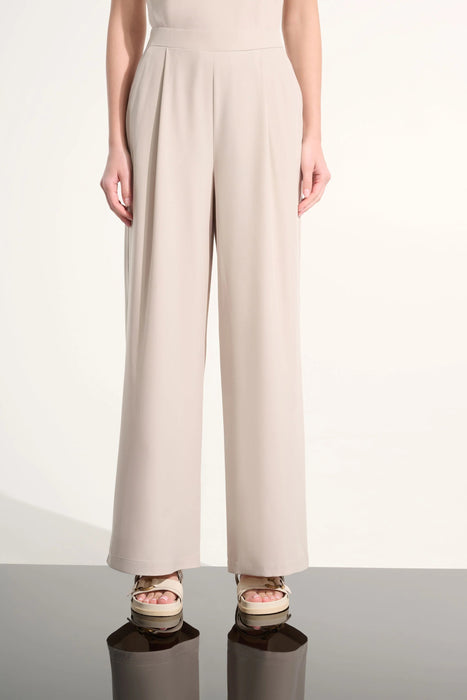 Woman wearing Joseph Ribkoff pull-on wide leg pants styled for office meetings, smart casual outings, travel days, and elegant everyday wear.