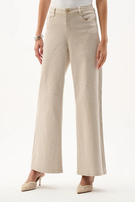 Woman wearing Joseph Ribkoff rhinestone denim wide leg jeans, featuring embellished neutral denim, wide leg silhouette, full length, and a flattering modern fit.