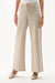 Woman wearing Joseph Ribkoff rhinestone denim wide leg jeans, featuring embellished neutral denim, wide leg silhouette, full length, and a flattering modern fit.