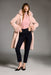 Woman wearing a pink coat with detachable faux fur trim and long sleeves from Joseph Ribkoff