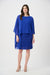 Woman wearing a blue textured sheath dress with lightweight chiffon poncho overlay from Joseph Ribkoff