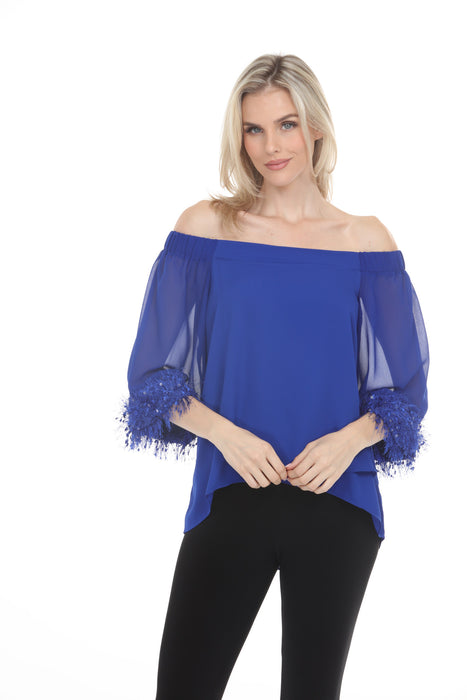 Woman wearing Joseph Ribkoff off shoulder chiffon top for cocktail party outfit