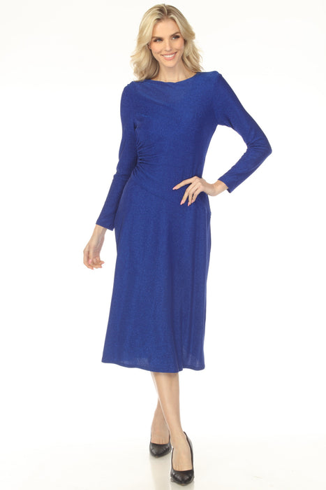 Woman wearing a blue shimmery fit and flare dress with ruching at the waist and long sleeves from Joseph Ribkoff