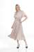 Woman wearing Joseph Ribkoff pleated satin dress for wedding guest outfit