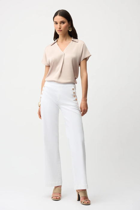 Woman wearing Joseph Ribkoff Satin Boxy Top with shirt collar, featuring a silky finish, relaxed boxy fit, and elegant minimalist design for modern chic styling.