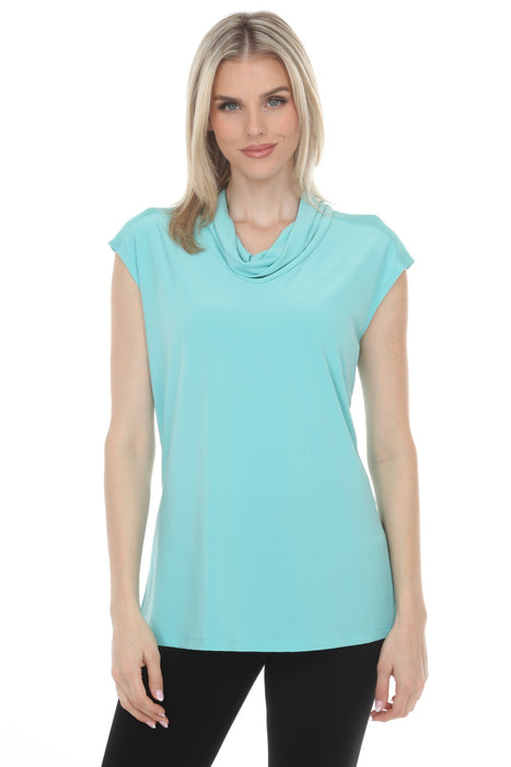 Woman wearing a light blue cap sleeve tunic top with cowl neck from Joseph Ribkoff
