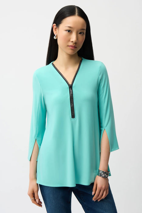 Woman wearing Joseph Ribkoff tunic top for elegant office outfit