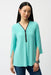 Woman wearing Joseph Ribkoff tunic top for elegant office outfit