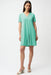 Woman wearing Joseph Ribkoff seafoam overlapping V-neckline A-line dress, featuring a soft flowy silhouette, short sleeves, and a flattering knee-length fit.