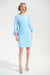 Woman wearing light blue A-line above the knee dress with sheer cape sleeves and slit neck from Joseph Ribkoff