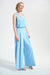 Woman wearing a light blue pleated wide leg pants with side pockets and high waist pull on waistband from Joseph Ribkoff
