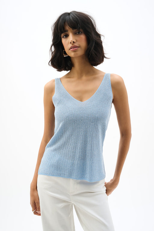 Woman wearing a metallic ribbed knit camisole with rhinestone details and V-neckline, styled for evening events, cocktail parties, date nights, or chic layered outfits.