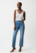 Woman wearing Joseph Ribkoff blue slim leg jeans with rhinestone detail, featuring a flattering stretch fit, mid-rise waist, and subtle sparkle for chic modern styling.