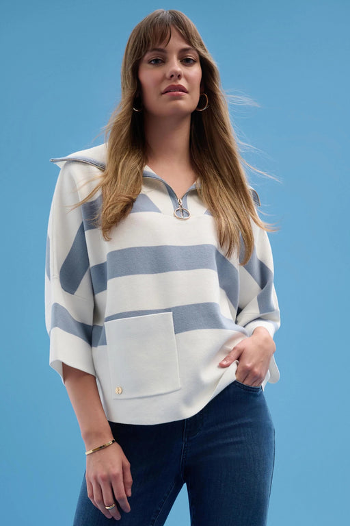 Woman wearing a striped sweater in white and blue with zip collar and 3/4 sleeves from Joseph Ribkoff