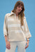 Woman wearing a striped sweater in white and beige with zip collar and 3/4 sleeves from Joseph Ribkoff