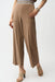 Woman in cropped stretch trousers with striped elastic waistband