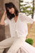 Shop Joseph Ribkoff Open Stitch Cardigan. Lightweight crochet knit with elbow sleeves and ribbed trim. Chic, breathable layering piece for women.