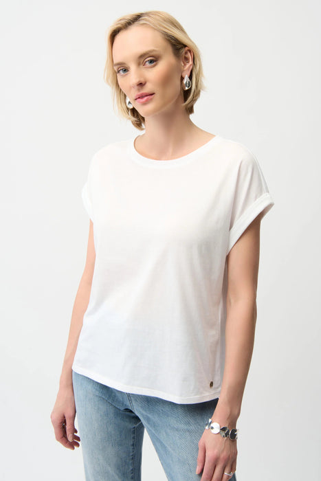 Woman wearing Joseph Ribkoff cotton boxy crewneck t-shirt top with dolman sleeves styled for casual chic outfits, office casual, and everyday wear.