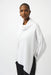 Woman wearing a solid color white sweater knit top with cowl neck and asymmetric hem
