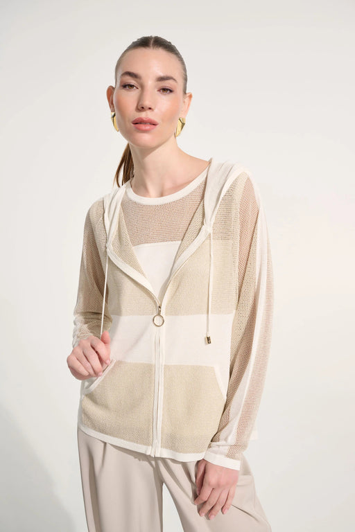Woman wearing a vanilla and gold straight hooded zip jacket with lightweight mesh fabric and sheer panels, styled for a modern and breathable layered look.