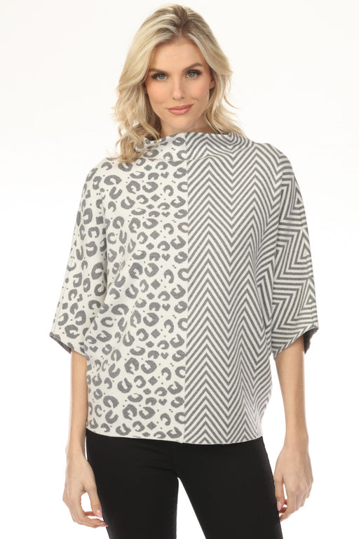 Woman wearing a mixed animal and chevron patterned boxy sweater top from Joseph Ribkoff