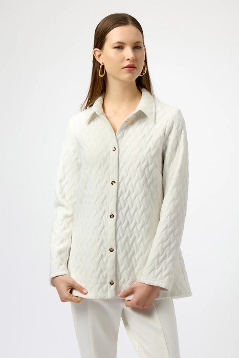 Woman wearing a white quilted jacket with button front and long sleeves from Joseph Ribkoff