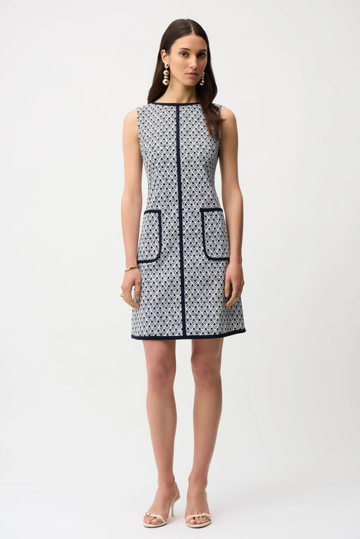 Woman wearing sleeveless A-line dress with geometric pattern and contrast trim from Joseph Ribkoff