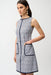 Woman wearing sleeveless A-line dress with geometric pattern and front pockets from Joseph Ribkoff