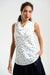 Woman wearing a white sleeveless top with dark blue polka dots and cowl neck from Joseph Ribkoff