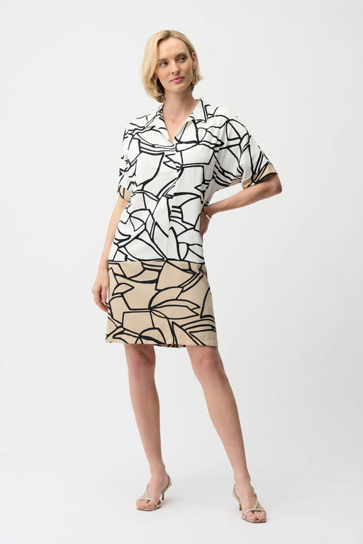 Woman wearing an abstract-printed shirt dress with color block hem and short sleeves from Joseph Ribkoff