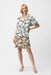 Woman wearing an abstract-printed shirt dress with color block hem and short sleeves from Joseph Ribkoff