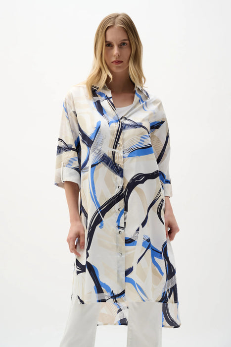 Woman wearing Joseph Ribkoff abstract print straight blouse styled for office wear, travel outfits, casual chic looks, and modern summer fashion.