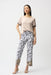 Woman wearing a white relaxed straight pants with black abstract pattern, pull on waistband and ankle length from Joseph Ribkoff