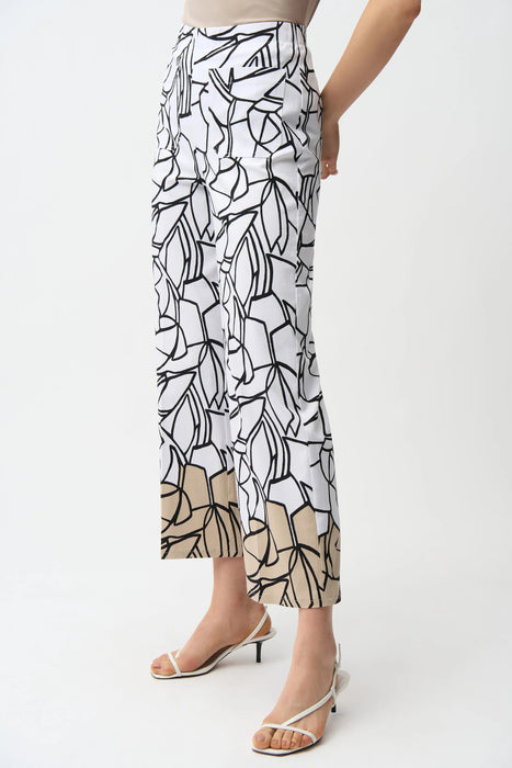 Woman wearing a white relaxed straight pants with black abstract pattern, pull on waistband and ankle length from Joseph Ribkoff