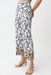 Woman wearing a white relaxed straight pants with black abstract pattern, pull on waistband and ankle length from Joseph Ribkoff