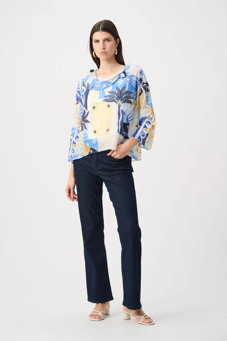 Woman wearing Joseph Ribkoff vanilla multi tropical print cowl neck boxy top with slim leg jeans featuring pearls and studs, embellished light-wash denim, cropped length, and a flattering modern fit.