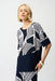 Woman wearing a geometric patterned short sleeve top with scoop neck and asymmetric hem from Joseph Ribkoff