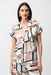 Woman wearing a short-sleeve blouse with geometric pattern and collared v-neck from Joseph Ribkoff