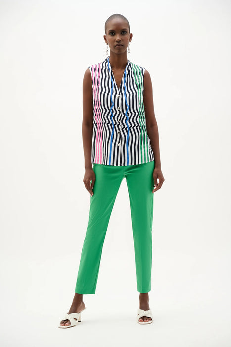 Woman wearing Joseph Ribkoff vanilla multi stripe sleeveless boxy blouse, featuring lightweight breathable fabric, relaxed fit, modern stripe design, and chic summer styling.