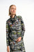 Woman wearing a tropical stripe patterned zip front jacket with high neck from Joseph Ribkoff
