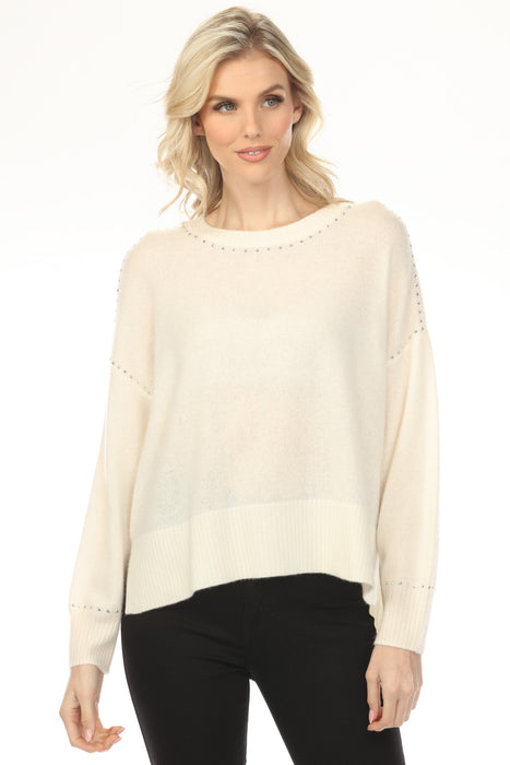Woman wearing a vanilla-colored crew neck sweater top with studs and long sleeves from Joseph Ribkoff