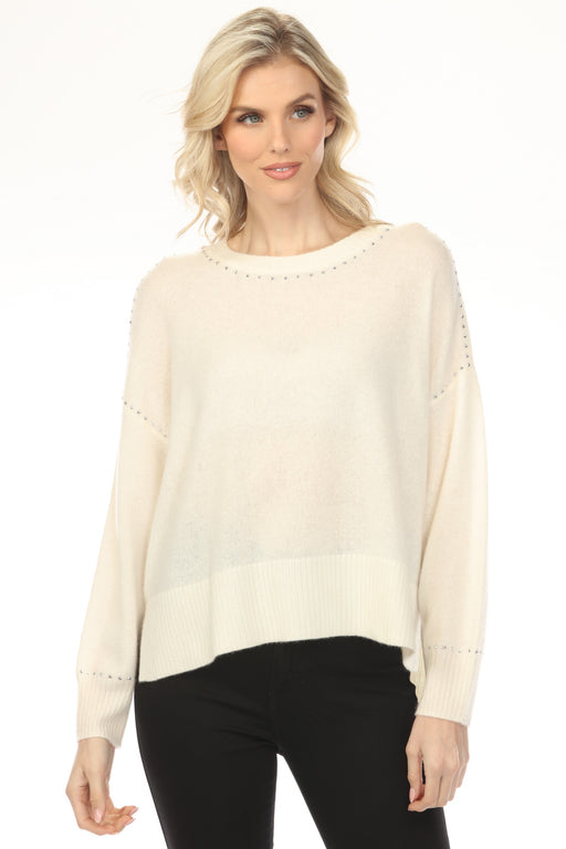 Woman wearing a vanilla-colored crew neck sweater top with studs and long sleeves from Joseph Ribkoff