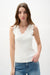 Woman wearing Joseph Ribkoff sweater knit fitted tank top with V-neck and scalloped trim styled for layering, office wear, and casual chic outfits.